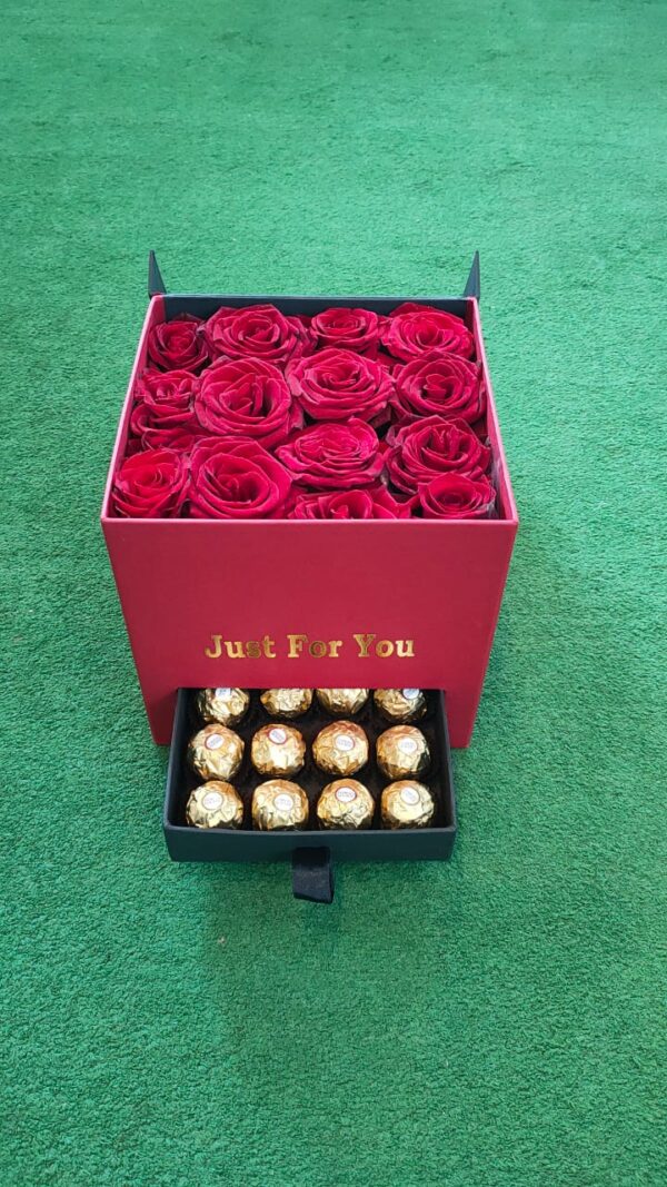 The Soul of Rose Valentine box-A group of red roses inside a very elegant red box, and there is also Ferrero chocolate inside the drawer